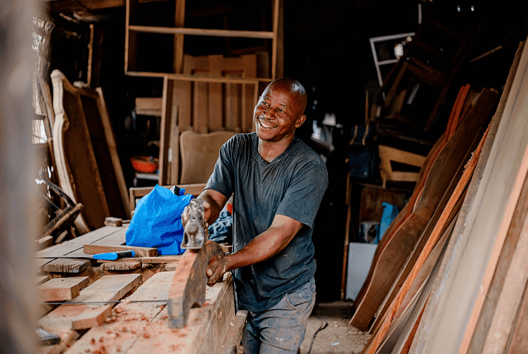 Artisan carpenter woodworking at bench