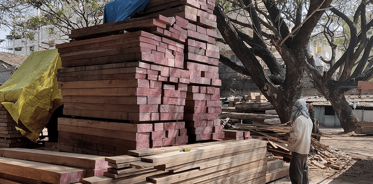 Blocks of wood piled up for selection in the timber yard